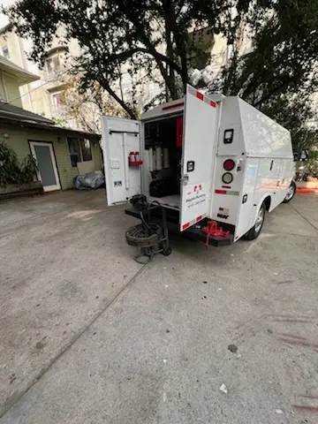 Magnet Plumbing service vehicle on-site for Grease Trap Cleaning in Oakland Forest